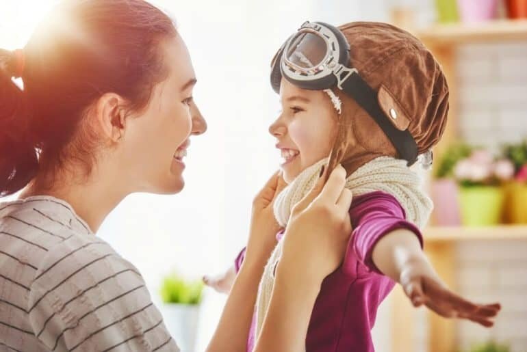 Inspirational Special Needs Quotes and Sayings mom smiling at special needs child dressed like superhero